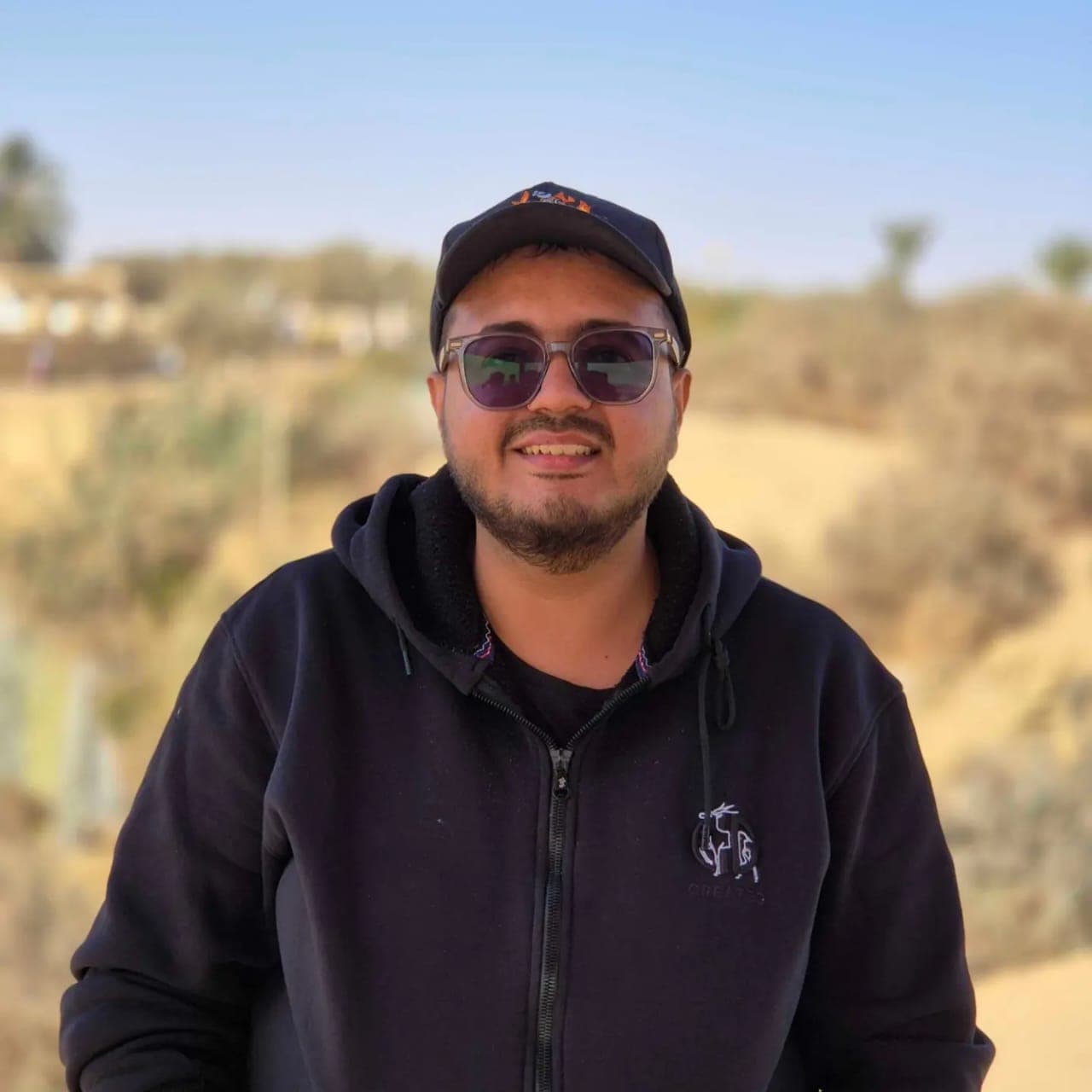 Abdelrhman Mohamed outdoors wearing a cap and sunglasses